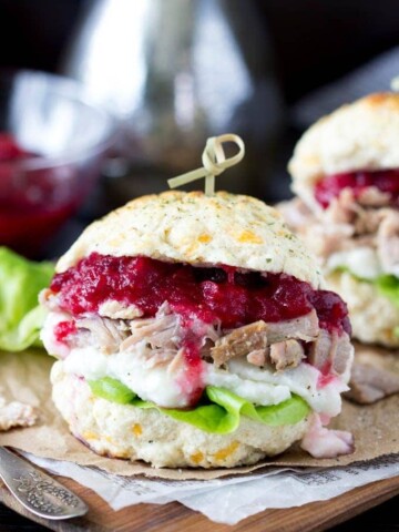 Thanksgiving leftovers- stuffing biscuit turkey, mashed potato and cranberry sandwich