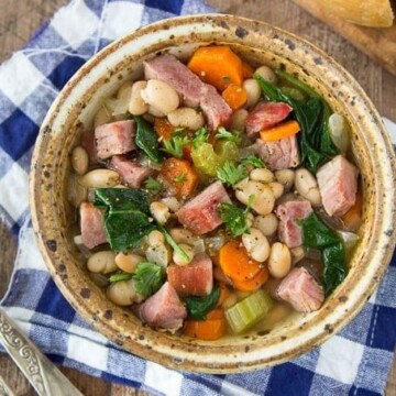 Ridiculously easy! This One Pot Ham & Bean soup is hearty and chock full of favorites like chunks of ham, white beans, carrots, celery and a bit of spinach for some extra veggie power.
