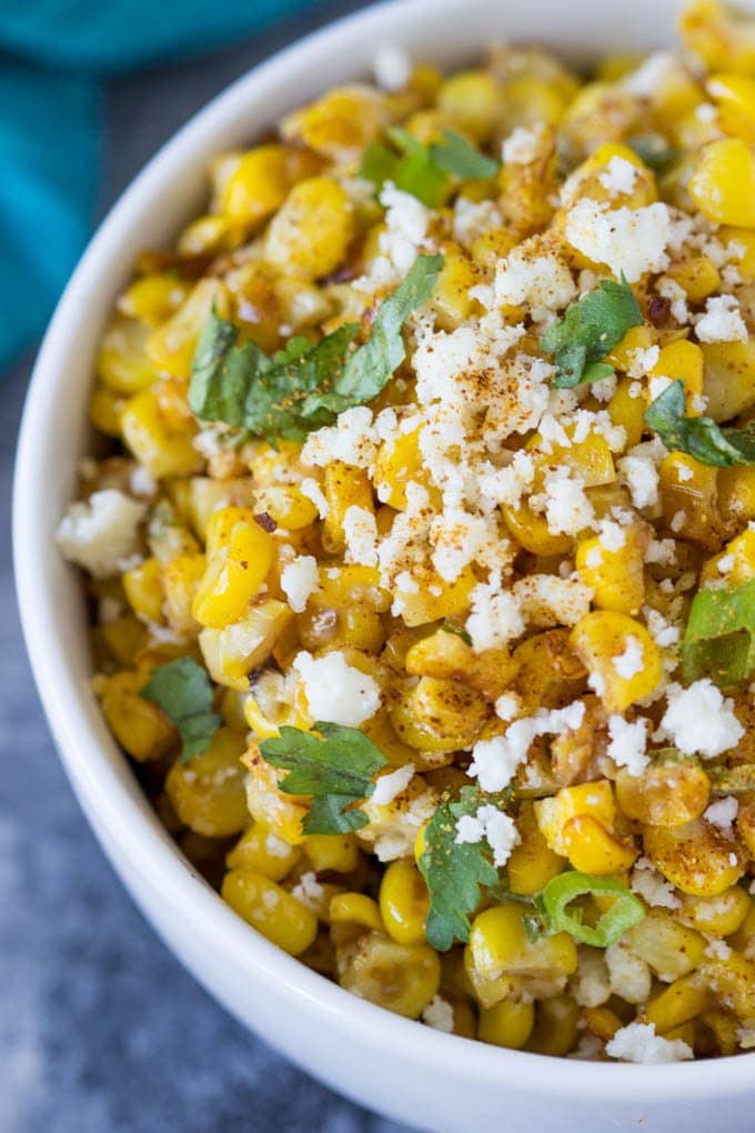 Skillet Mexican Street Corn being served in a white bowl