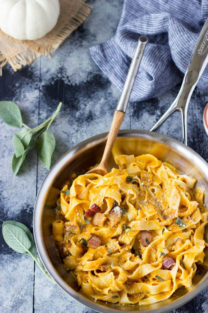So easy! Only a few simple ingredients needed to make this healthy Fall inspired meal. Creamy pumpkin sauce tossed with fettuccine, Parmesan, bacon & sage| simplehealthykitchen.com #easy # pumpkin #fettuccine