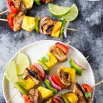 Curry Pork + Pineapple Kabobs- The perfect combination of savory and sweet! You can whip up these nutritious skewers of juicy curry marinated pork, red and green bell peppers, onions and sweet juicy pineapple in just a few minutes. Fire up the BBQ or cook them indoors on the stove-top or in the oven