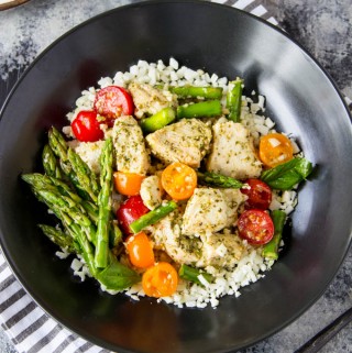 Skillet Pesto Chicken- This one-pan skillet dinner can easily become your "go-to" weeknight meal. Only 5 ingredients and about 20 minutes total time needed to whip up this healthy meal. Bonus! the 5 ingredients can be found year round but this recipe can easily be customized to take advantage of seasonal produce favorites.