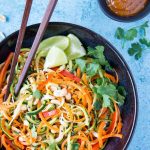 Sesame Peanut Zucchini + Carrot Noodles - Spiralized zucchini and carrot “noodles” are tossed in a tasty sesame peanut sauce. A light and flavorful pasta alternative that makes a great side dish or add your favorite protein ( like chicken, shrimp or tofu) for a healthy full meal option. Ready in 10 mins.{ Clean eating, Vegan, easily Paleo}