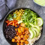 Homemade Burrito Bowl ingredients assembled in a black bowl