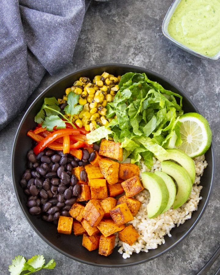Homemade Burrito Bowl ingredients assembled in a black bowl